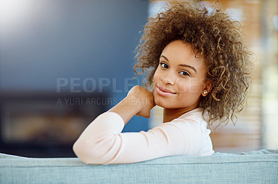 Buy stock photo Portrait of a young woman relaxing on the sofa at home