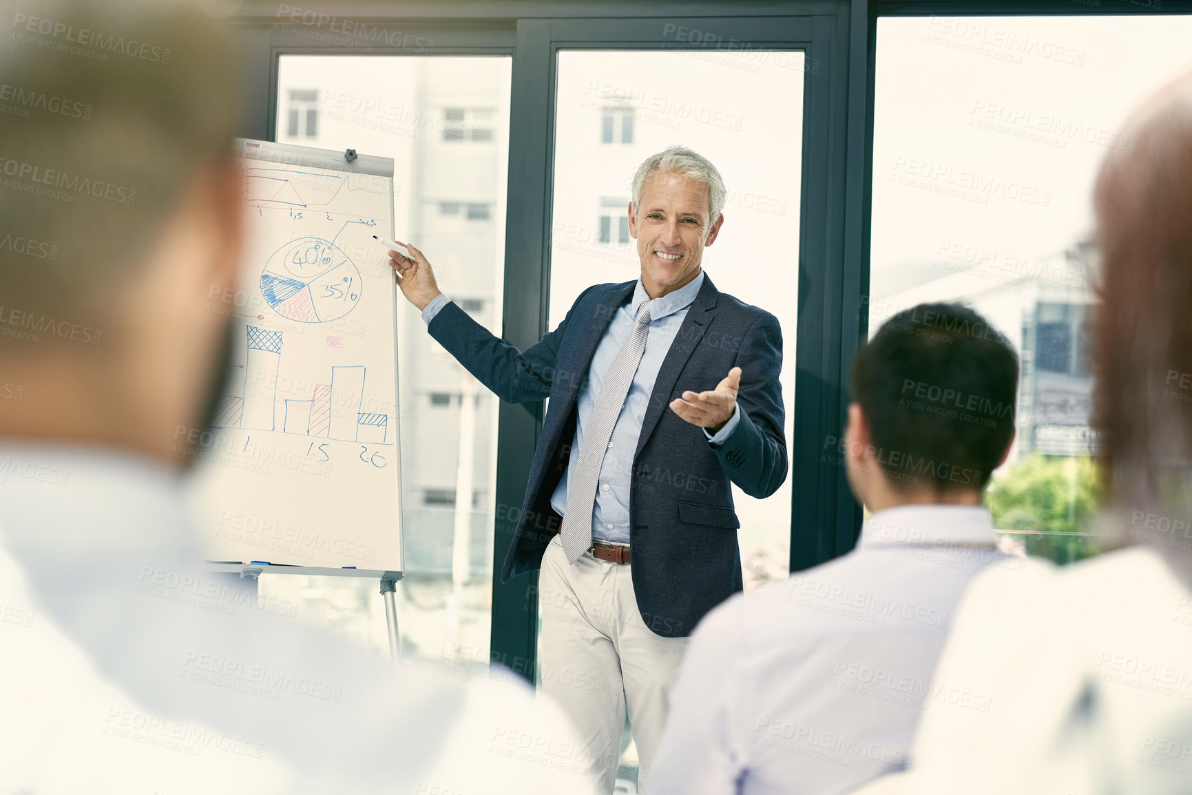 Buy stock photo Shot of a group of businesspeople in a presentation