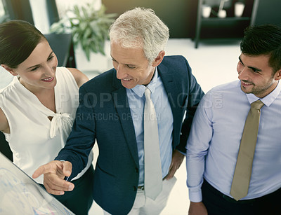 Buy stock photo Shot of a group of businesspeople in a presentation