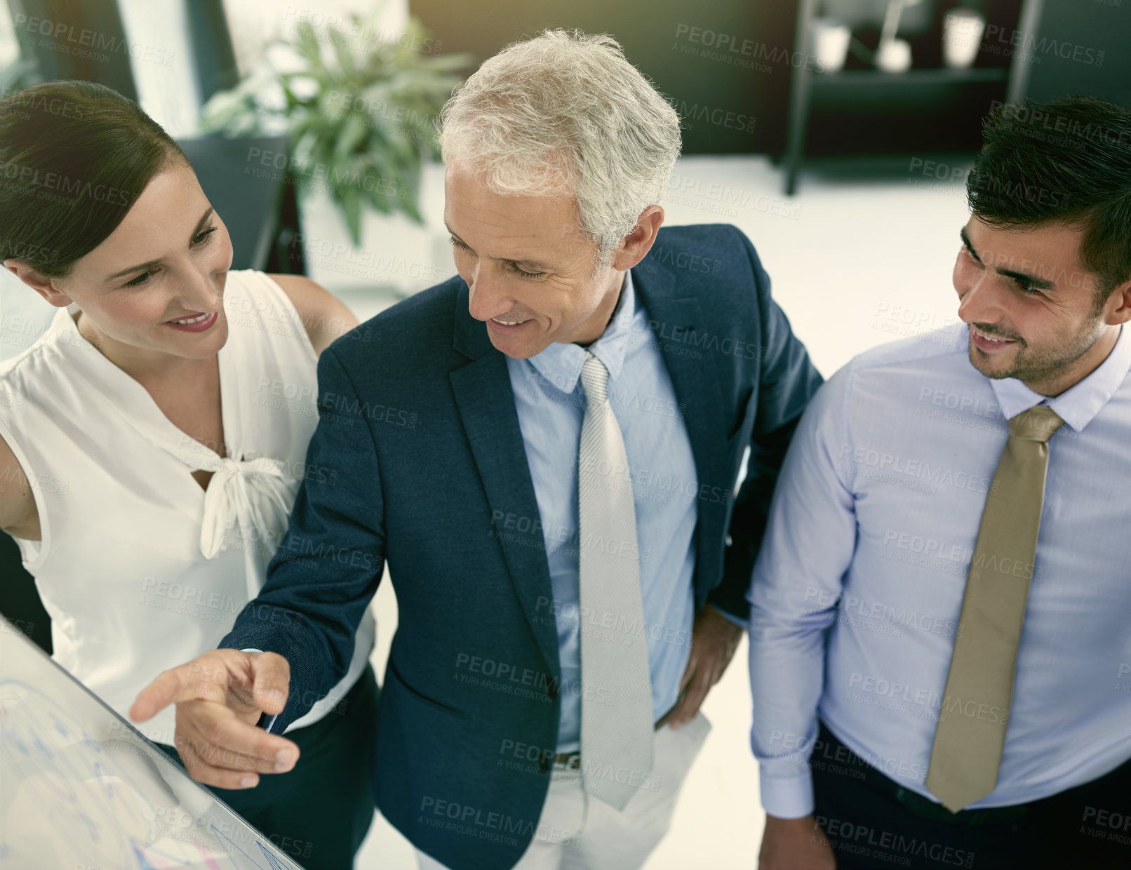 Buy stock photo Shot of a group of businesspeople in a presentation