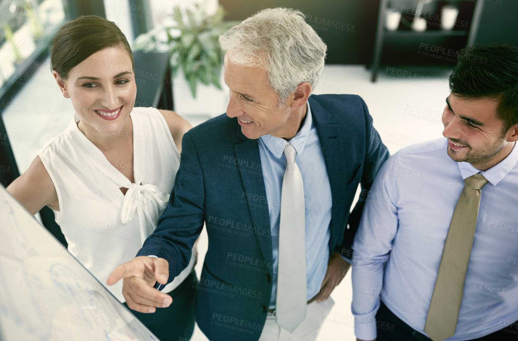 Buy stock photo Shot of a group of businesspeople in a presentation
