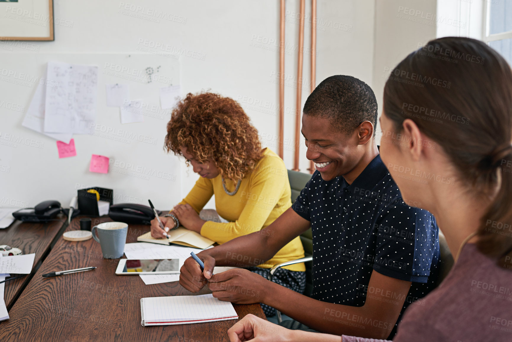 Buy stock photo Shot of a group of colleagues having a meeting in a modern office