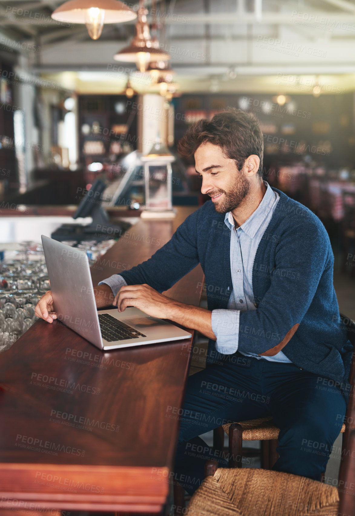 Buy stock photo Business owner, smile and man with laptop in restaurant for stock, update or communication with supplier. Male person, pub and happy with technology for planning, market research and information