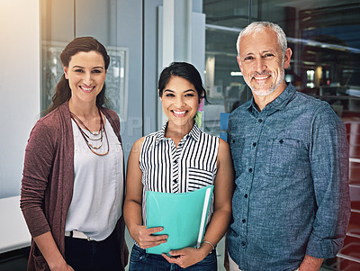 Buy stock photo Cropped portrait of three colleagues standing in the office