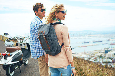 Buy stock photo Shot of a young couple enjoying a day outdoors