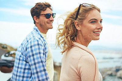 Buy stock photo Shot of a young couple enjoying a day outdoors