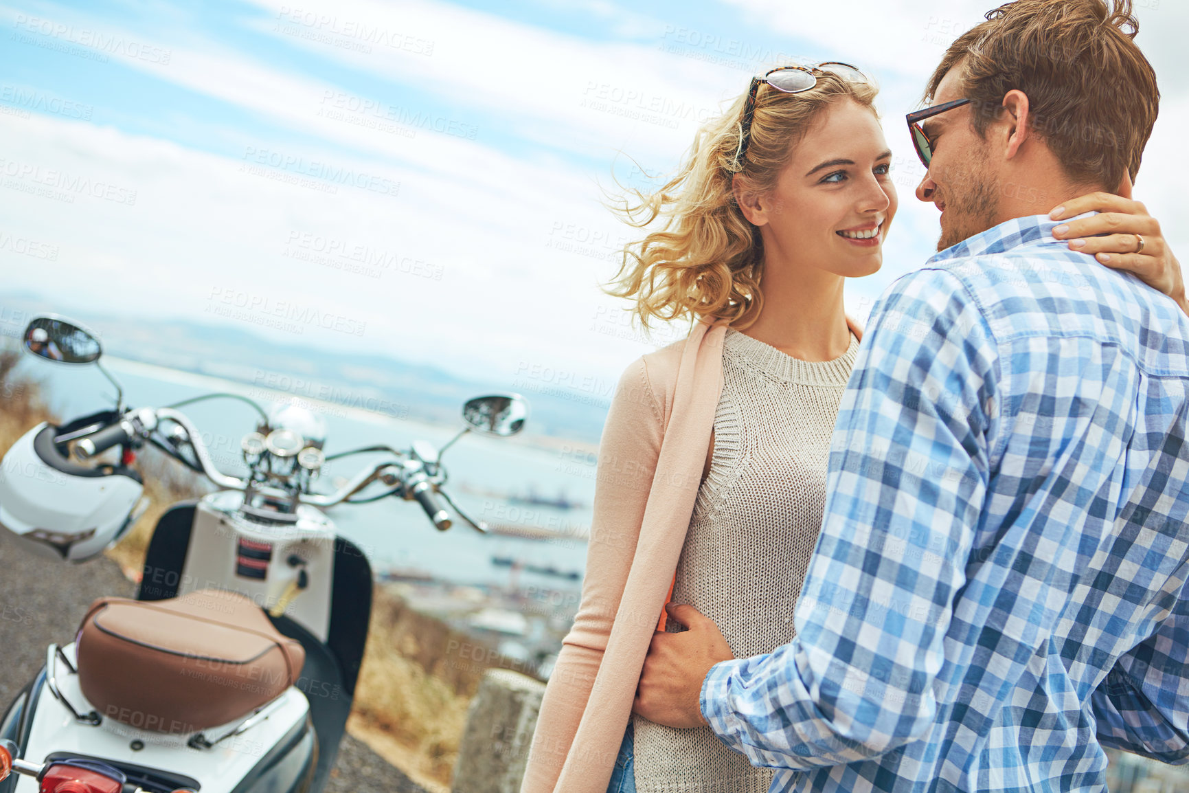 Buy stock photo Shot of a couple having a intimate moment while out on the road