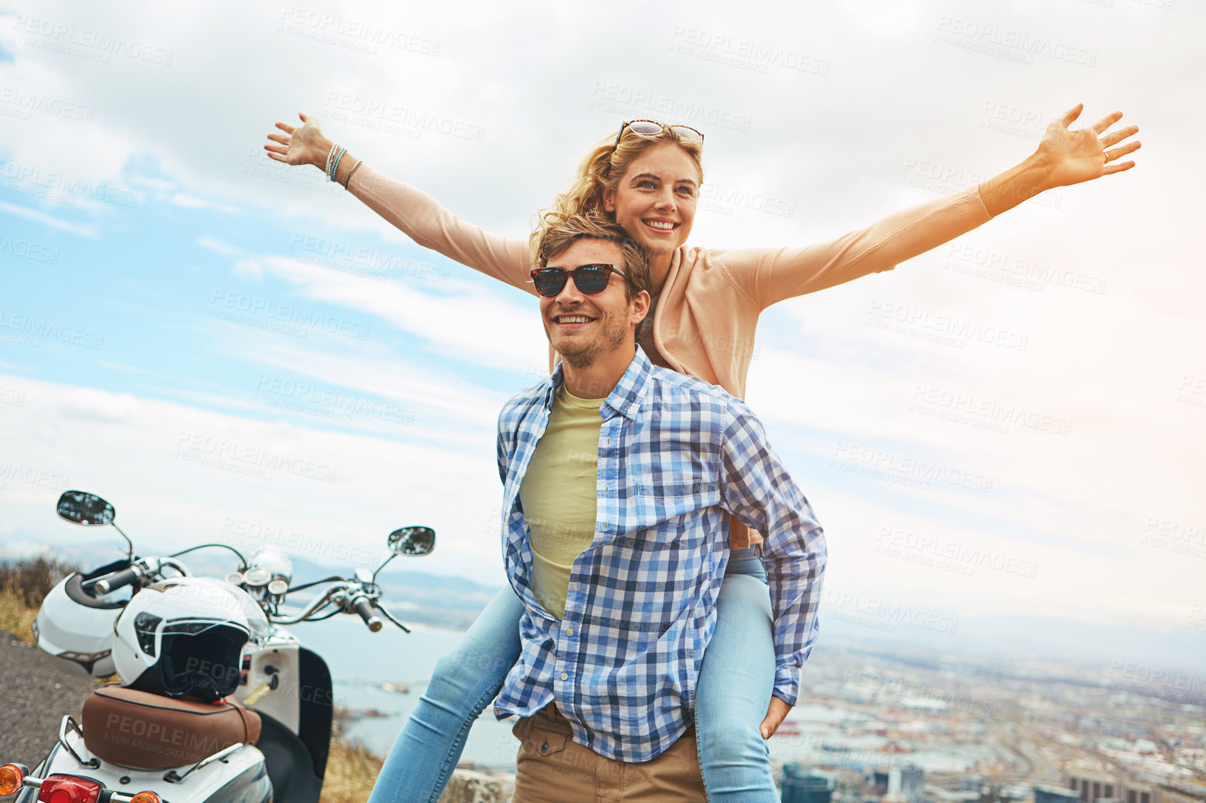 Buy stock photo Shot of a young couple enjoying a day outdoors