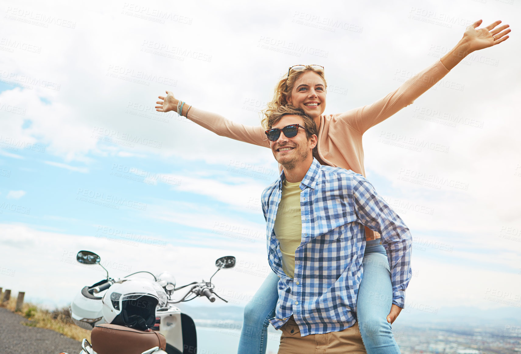 Buy stock photo Shot of a young couple enjoying a day outdoors