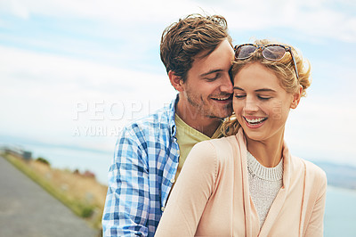Buy stock photo Shot of a young couple enjoying a day outdoors