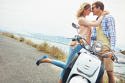 Buy stock photo Shot of a couple having a intimate moment while out on the road