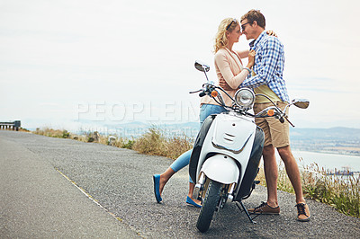 Buy stock photo Shot of a couple having a intimate moment while out on the road