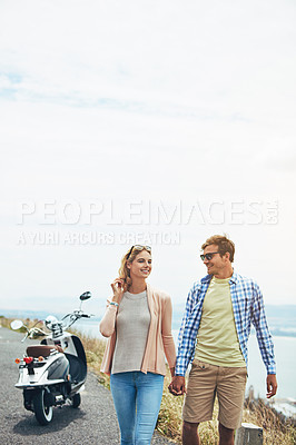 Buy stock photo Shot of a young couple enjoying a day outdoors