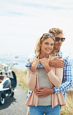 Buy stock photo Shot of a young couple enjoying a day outdoors