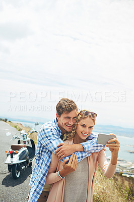 Buy stock photo Shot of a couple taking a selfie outdoors