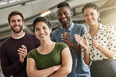 Buy stock photo Portrait of a team of colleagues standing in an office and clapping