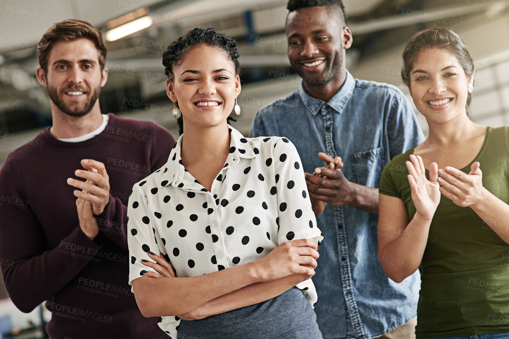 Buy stock photo Portrait of a team of colleagues standing in an office and clapping