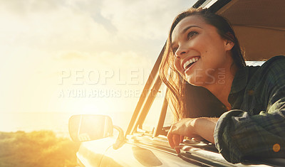 Buy stock photo Cropped shot of a young woman on a road trip to the beach at sunset
