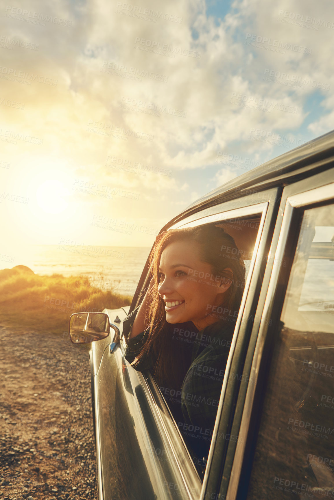 Buy stock photo Happy woman, sunset and window with car for road trip, travel or outdoor journey in nature. Female person, tourist or holiday with smile in vehicle for adventure, transport or vacation by ocean coast