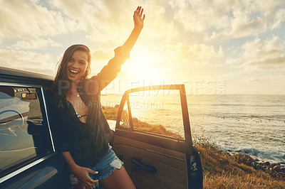 Buy stock photo Cropped portrait of a young woman on a road trip to the beach at sunset