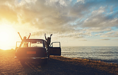 Buy stock photo Friends, silhouette and sunset at beach with car, sky and hands in air for freedom, celebration and happy. Summer sunshine, holiday and ocean with vintage suv, travel and women by waves for happiness