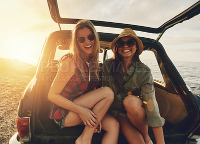 Buy stock photo Women friends, portrait and car trunk on road trip, beach or relax on holiday for sunset with smile. Woman, outdoor and friendship happiness, ocean vacation or sunglasses for summer sunshine together