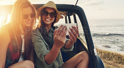 Buy stock photo Friends, smile and road trip phone selfie with sunset for travel holiday, summer vacation and relax together outdoor. Women, happy and smartphone photography for adventure or countryside sunshine 