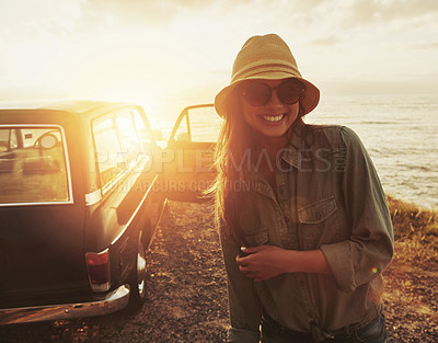 Buy stock photo Woman, road trip and smile for sunset journey, travel or vacation with a view of the ocean in outdoor nature. Happy female traveler smiling in happiness for summer with lens flare for a beach drive