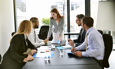 Buy stock photo Shot of a team of executives having a formal meeting in a boardroom