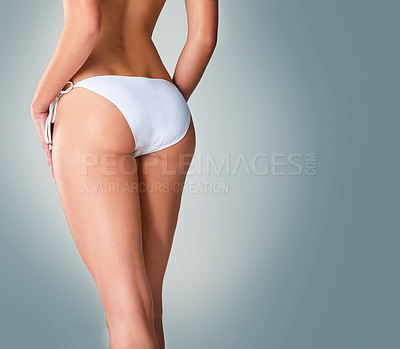 Buy stock photo Cropped closeup shot of a woman in underwear against a gray background
