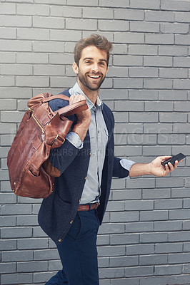 Buy stock photo Outdoor, portrait and business with man, smartphone and typing with employee and bag with wall background. New York city, person and agent with cellphone and mobile user with fashion and digital app 