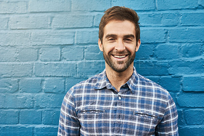Buy stock photo Man, smile in portrait and relax against wall background, casual fashion and positivity with blue aesthetic. Confidence, pride and model in checkered shirt, style and lumberjack outfit in Australia