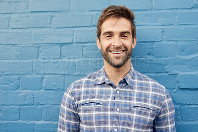 Buy stock photo Man, happy in portrait and relax against wall background, casual fashion and positivity with blue aesthetic. Confidence, pride and model in checkered shirt, style and lumberjack outfit in Australia