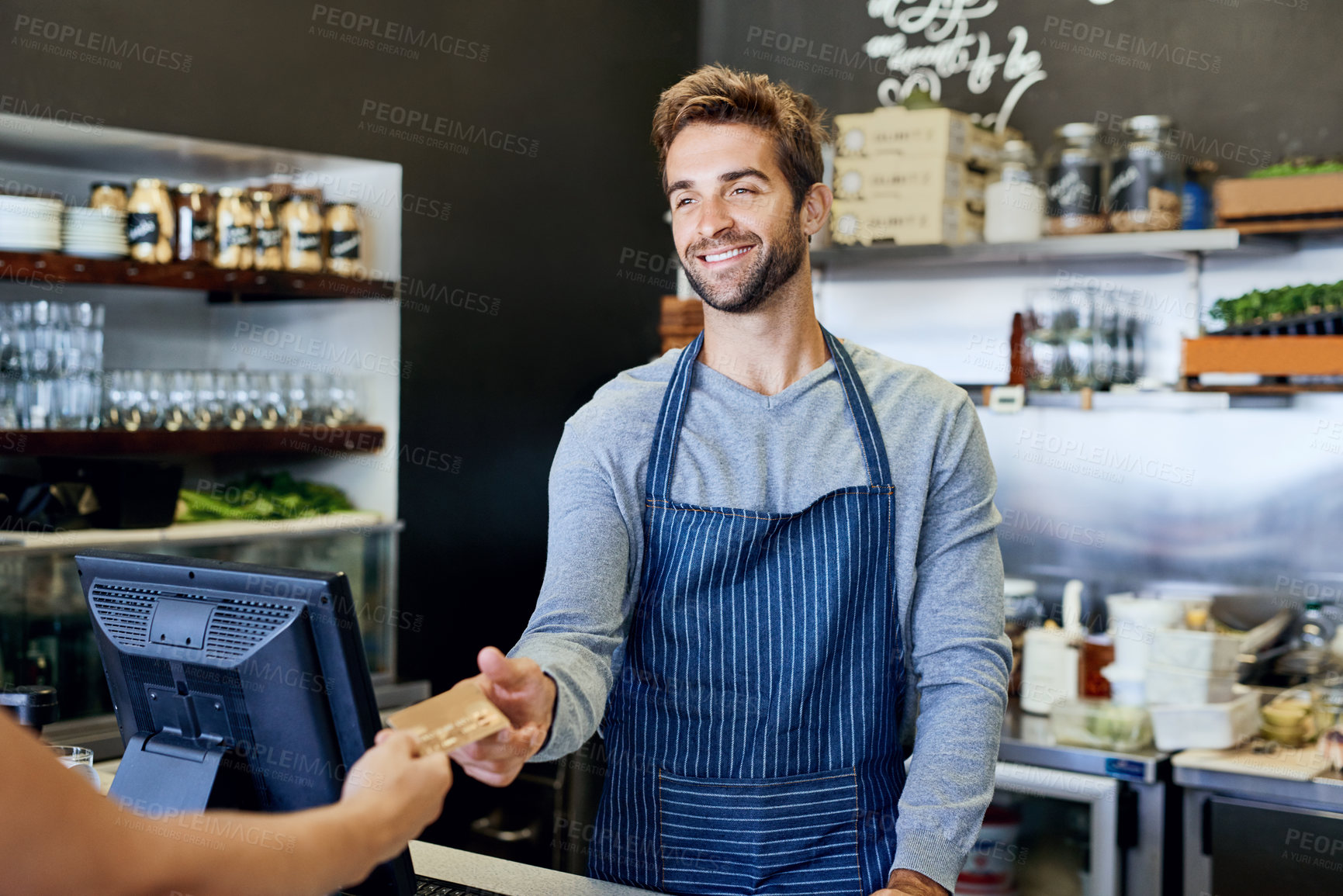 Buy stock photo Barista, payment and customer with credit card at cafe, restaurant and hand at small business startup. Smile, service and retail purchase of cashier for shopping, finance and sales of man with money