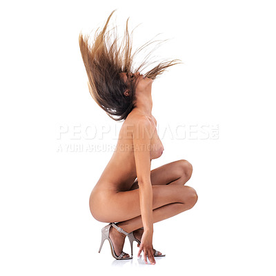 Buy stock photo Studio shot of a beautiful young woman twirling her hair posing nude isolated on white