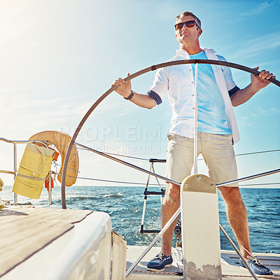 Buy stock photo Shot of a man out on a boat trip alone