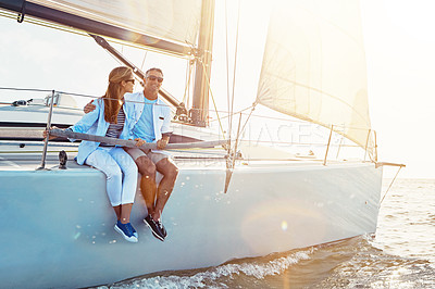Buy stock photo Couple, yacht cruise and relax on ocean for sunset travel holiday, summer vacation or quality time together. Luxury sailing adventure, man and woman bonding and happy for love or outdoor lifestyle