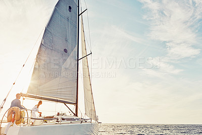 Buy stock photo Shot of a couple out sailing on a yacht