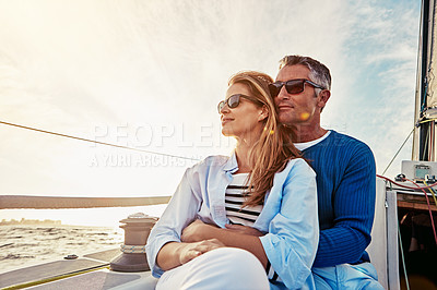 Buy stock photo Yacht, travel and love with a mature couple sitting together on a boat out at sea for a romantic date. Luxury, ocean or summer with a married man and woman on a ship to relax during a trip