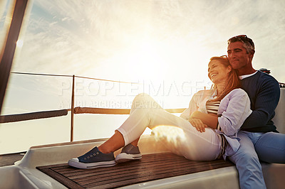Buy stock photo Hug, sunset and couple on a yacht for travel, retirement holiday and ocean adventure in Spain. Investment, hobby and man and woman on a boat for a luxury cruise, sailing and happiness at sea