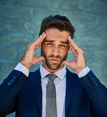 Buy stock photo Businessman, portrait and headache of stress outdoor with burnout, overwhelmed by workload and frustrated. Professional, employee and migraine with tension, pain and workplace anxiety by brick wall