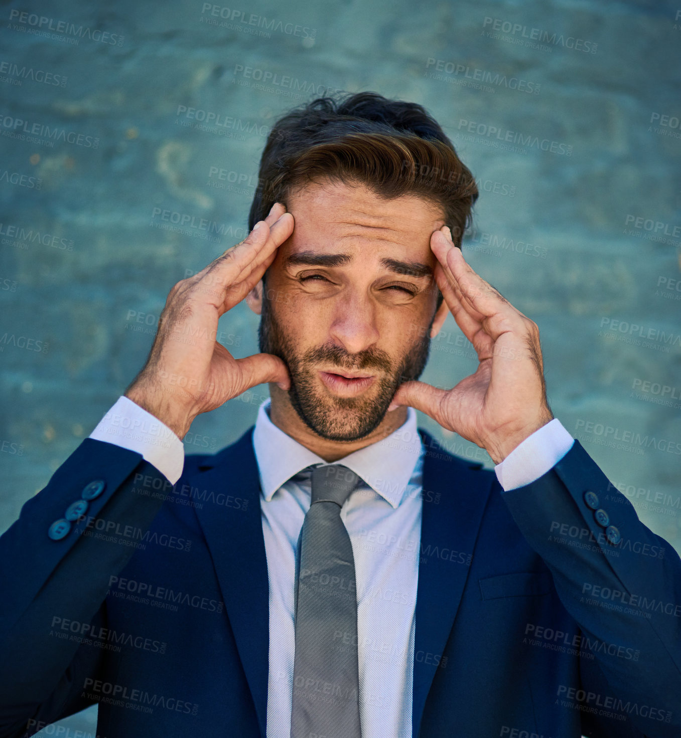 Buy stock photo Businessman, portrait and headache of stress outdoor with burnout, overwhelmed by workload and frustrated. Professional, employee and migraine with tension, pain and workplace anxiety by brick wall