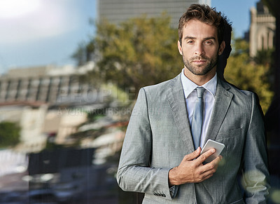 Buy stock photo Portrait, businessman and phone on glass window as property agent with social media, tech and suit in outdoor. Male person, pride and real estate for work, corporate or career in New York City