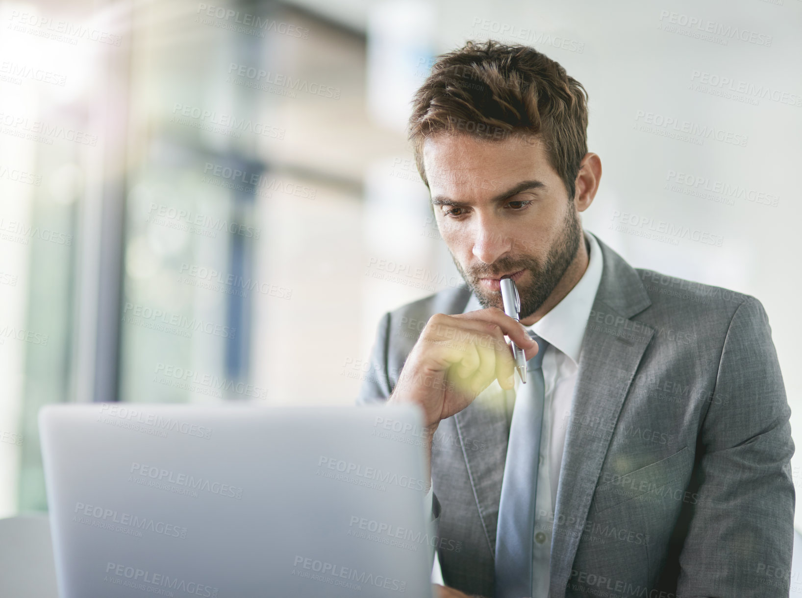 Buy stock photo Thinking, laptop and businessman in office with pen for online company, project and planning in workplace. Web designer, technology and male person in creative agency for research and brainstorming.