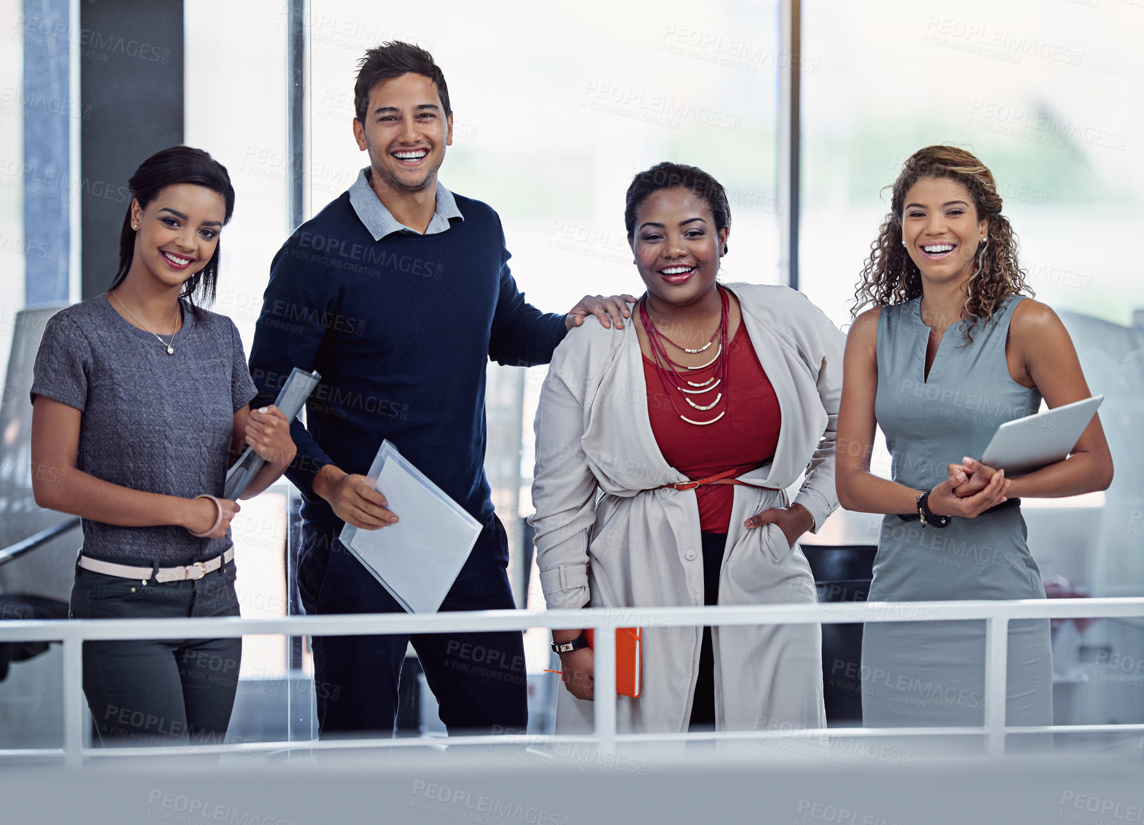 Buy stock photo Portrait of a group of smiling colleagues working together in an office