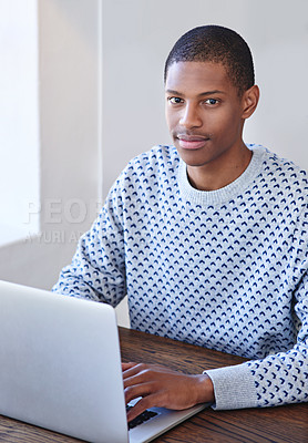 Buy stock photo Cropped portrait of a young designer working on his laptop