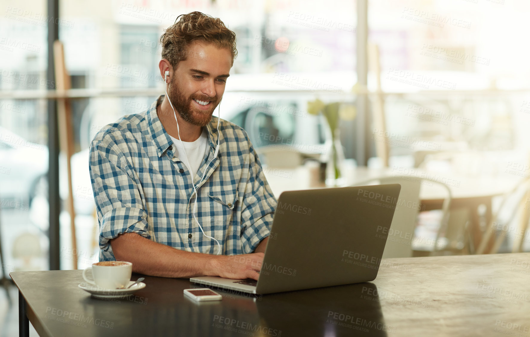 Buy stock photo Man, laptop or typing in cafe with earphones for story recording, listening to podcast or smile for online video. Remote work, journalist or technology in coffee shop for editing blog post or article