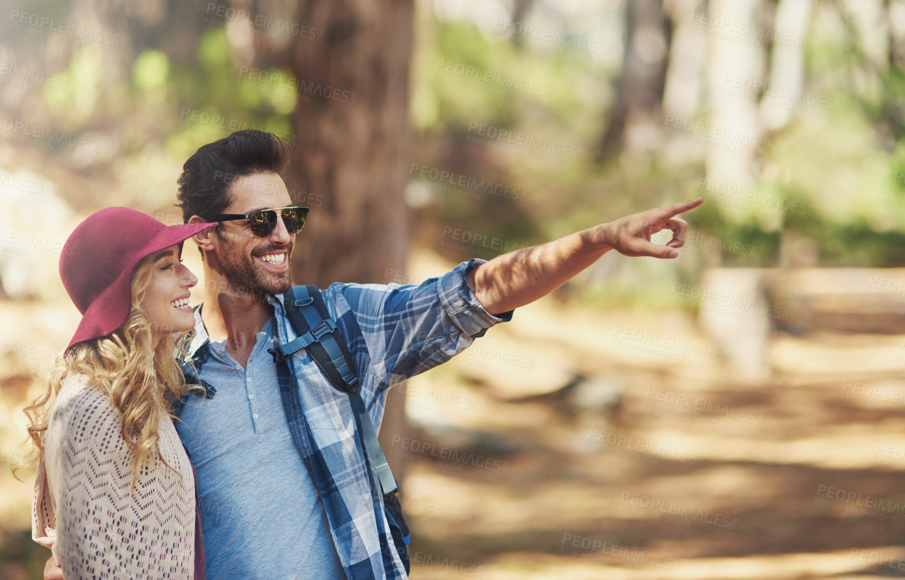 Buy stock photo Happy, couple and pointing in outdoor for hiking or bird watching on vacation for explore, adventure or journey. Man, woman and together in forest or nature on travel holiday in New Zealand with love