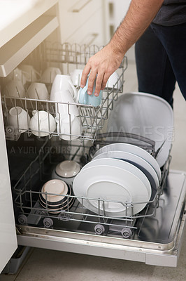 Buy stock photo Cleaning, loading dishwasher and hands with dishes in the kitchen for housework and responsibility. Lifestyle, morning and a person doing housekeeping, organizing crockery and clean equipment