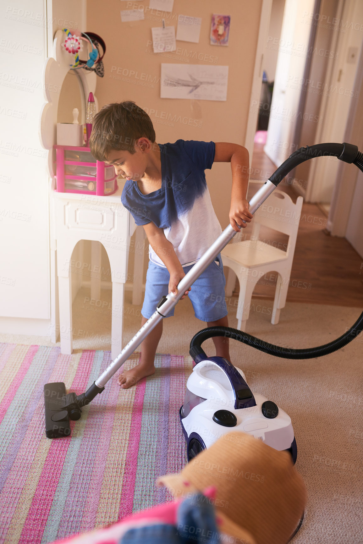 Buy stock photo Child, carpet and vacuum for cleaning in bedroom, house and at home for child development and growth. Lens flare, youth and machine for responsible housekeeping, learning and chores for hygiene